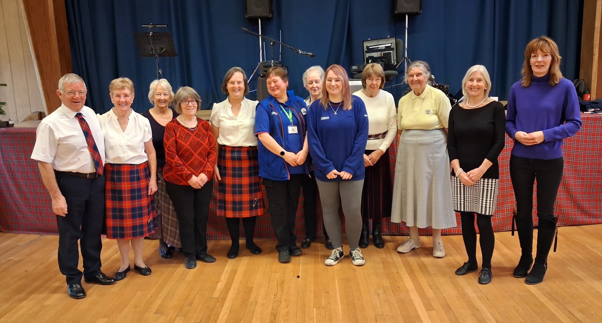 Musician Sam, Galashiels teachers and Tesco representatives 2025